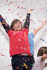 Image showing kids  blowing confetti