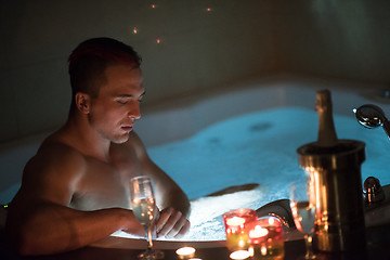 Image showing man relaxing in the jacuzzi