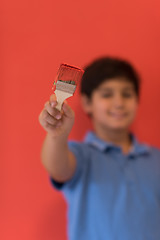 Image showing Portrait of a happy young boy painter