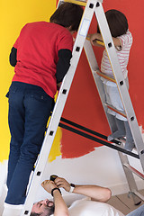 Image showing boys painting wall