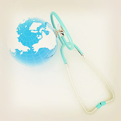 Image showing Stethoscope and Earth.3d illustration. Vintage style.