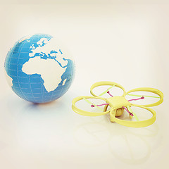 Image showing Quadrocopter Drone with Earth Globe and remote controller on a w