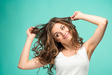 Image showing The young woman\'s portrait with happy emotions