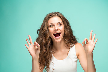 Image showing The young woman\'s portrait with happy emotions