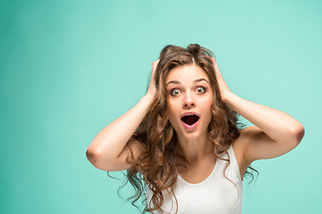 Image showing Portrait of young woman with shocked facial expression