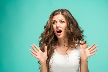 Image showing Portrait of young woman with shocked facial expression