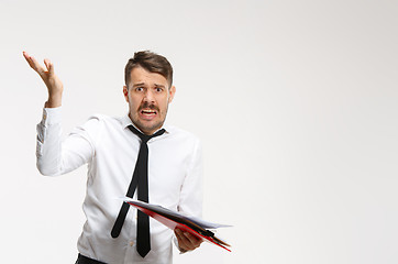 Image showing The troubled business couple at the office. The man looking at c