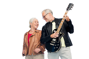 Image showing happy senior couple with electric guitar