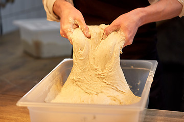 Image showing chef or baker cooking dough at bakery