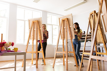 Image showing woman artists or students painting at art school