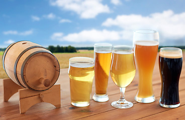 Image showing different types of beer in glasses on table