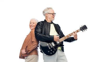 Image showing happy senior couple with electric guitar