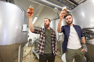 Image showing men testing non-alcoholic craft beer at brewery