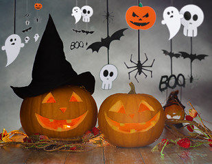 Image showing carved pumpkins in witch hat and halloween garland