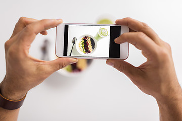 Image showing man photographing healthy breakfast by smartphone