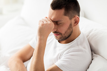 Image showing close up of stressed man in bed at home