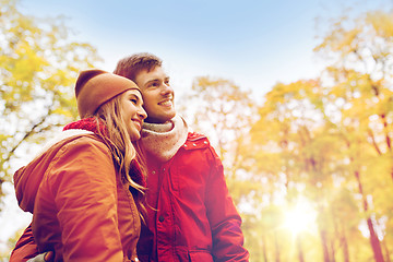 Image showing happy young couple walking in autumn park