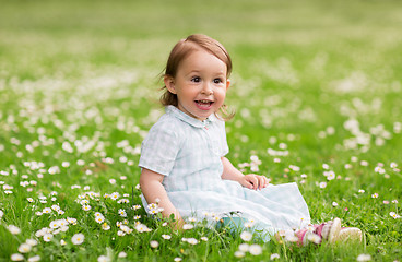 Image showing happy baby girl on green summer field