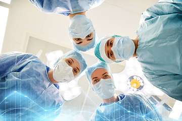 Image showing group of surgeons in operating room at hospital