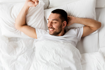 Image showing man lying in bed at home