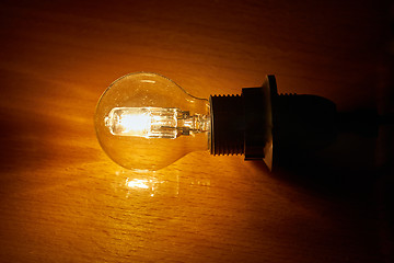 Image showing Light bulb on a table