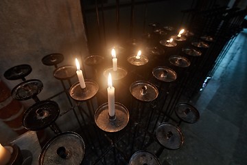 Image showing Candles in a dark church