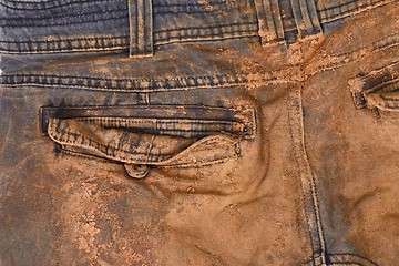 Image showing Trousers with mud