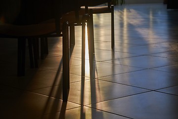 Image showing Sunlight glow between classroom chairs