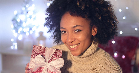 Image showing Woman holding Christmas gift with copy space