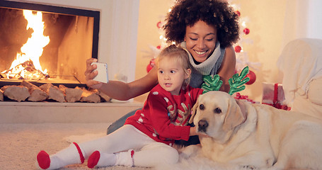 Image showing Mixed race family taking christmas selfie