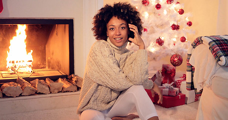 Image showing Woman by fireplace and white christmas tree