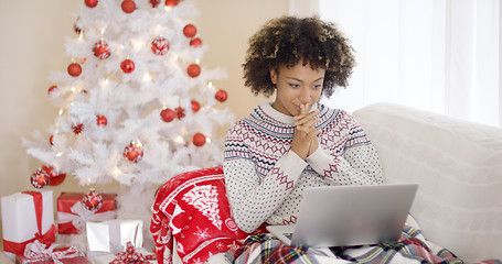 Image showing Happy excited woman reading a Christmas message