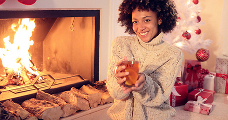 Image showing Happy young woman relaxing at Christmas