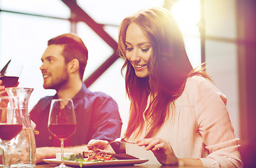 Image showing happy couple having dinner at restaurant