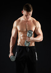 Image showing man with dumbbells exercising