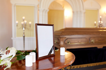 Image showing photo frame and coffin at funeral in church