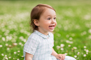 Image showing happy baby girl on green summer field