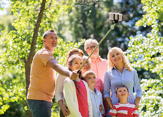 Image showing happy family taking selfie in summer garden