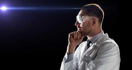 Image showing doctor or scientist in lab coat and safety glasses