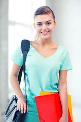 Image showing student girl with school bag and color folders