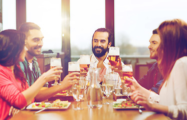 Image showing friends dining and drinking beer at restaurant