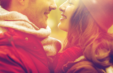 Image showing close up of happy young couple kissing outdoors