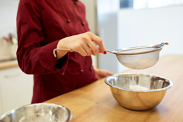 Image showing chef with flour in bowl making batter or dough