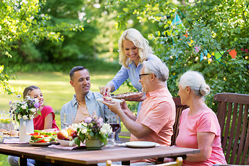 Image showing happy family having dinner or summer garden party