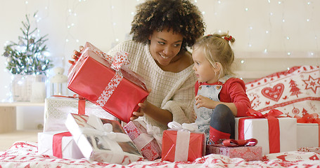 Image showing Mother showing child a large Christmas gift