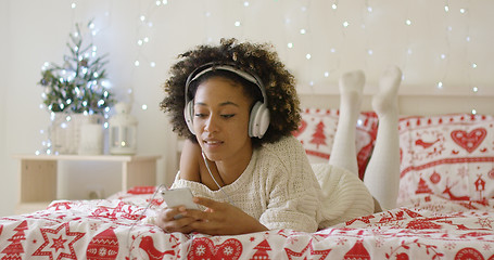 Image showing Attractive young woman relaxing at Christmas