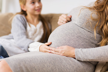 Image showing close up of pregnant woman and girl at home