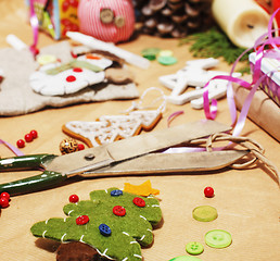 Image showing lot of stuff for handmade gifts, scissors, ribbon, paper with countryside pattern, ready for holiday concept, nobody home 