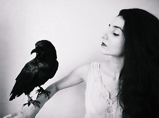 Image showing young woman with raven