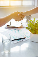 Image showing Business partnership meeting concept. Image businessmans handshake. Successful businessmen handshaking after good deal. Horizontal, blurred background